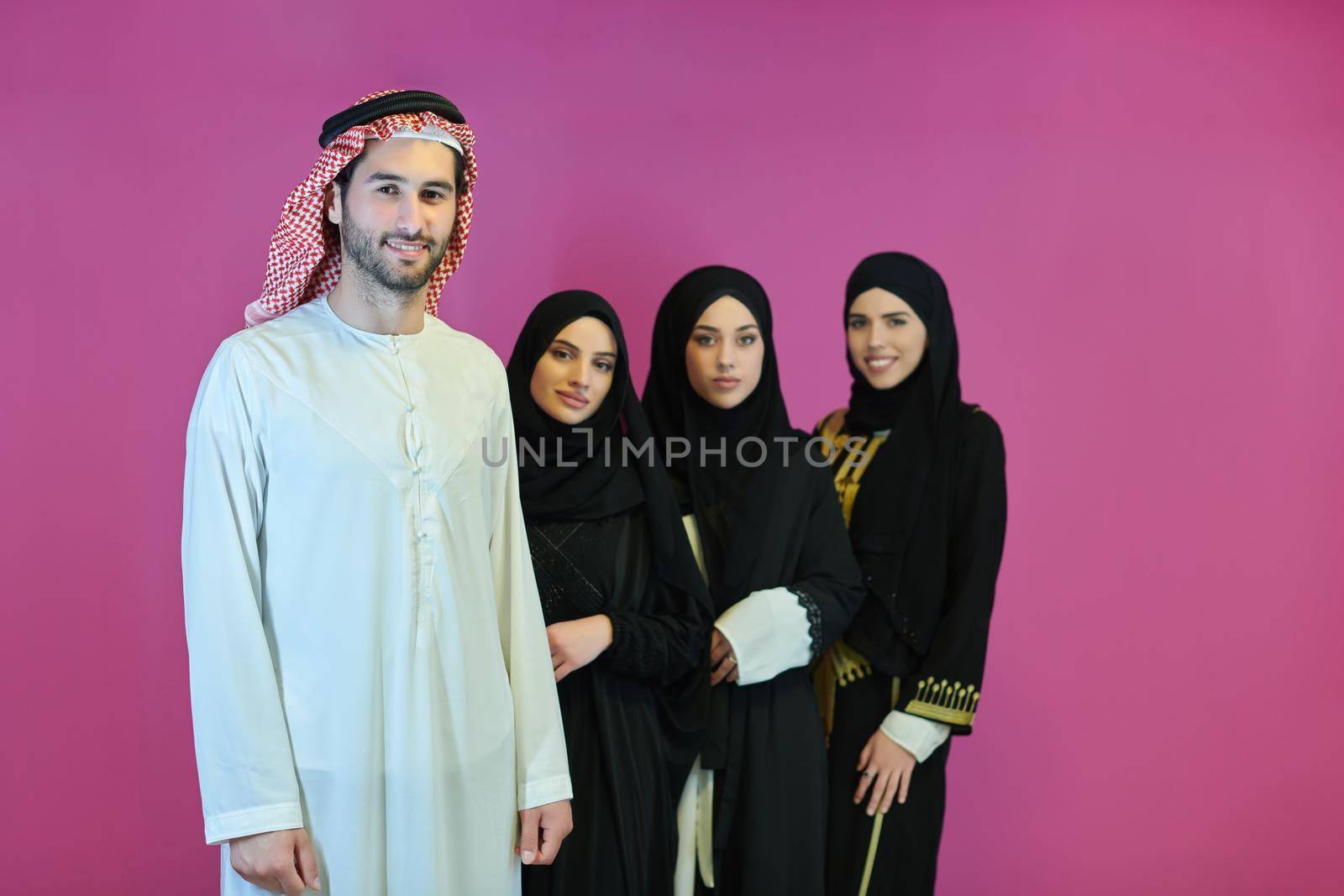 Portrait of young muslim people in traditional clothes by dotshock