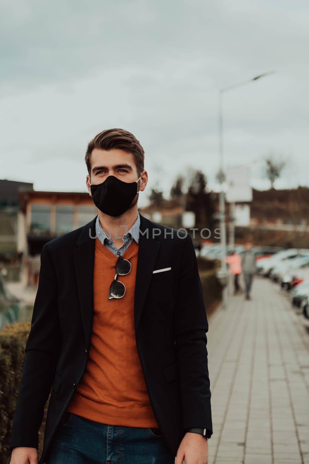  businessman wearing medical mask at the street by dotshock