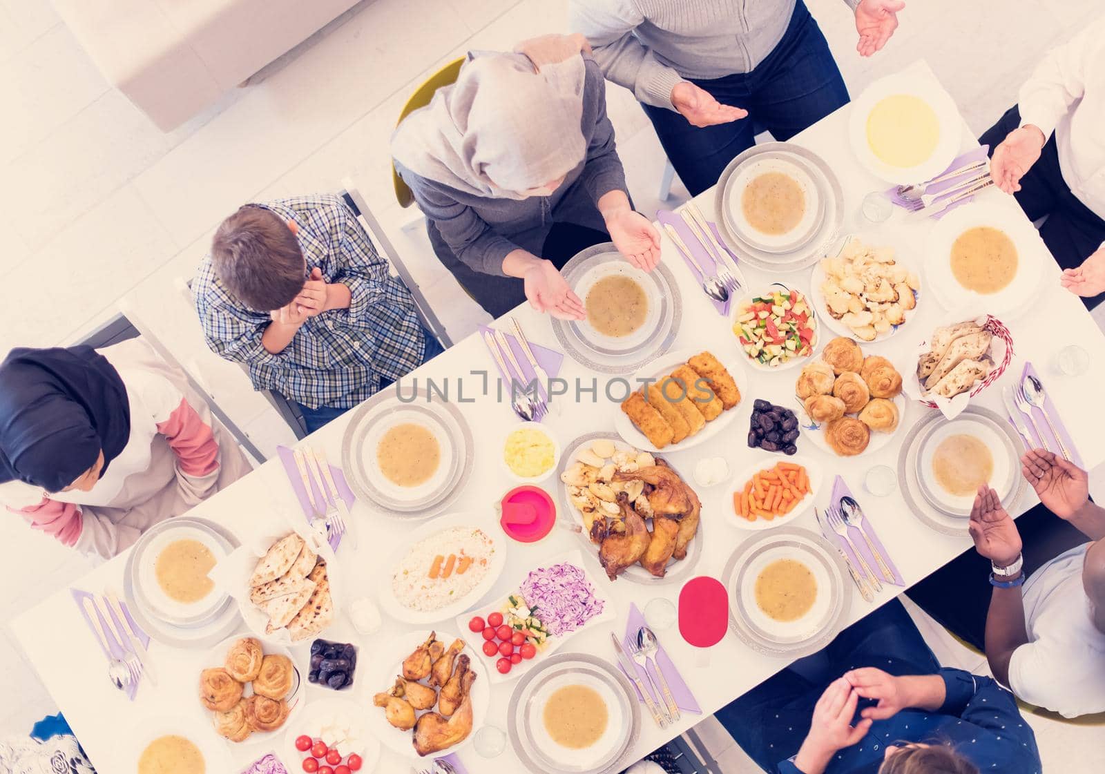 top view of modern muslim family having a Ramadan feast by dotshock