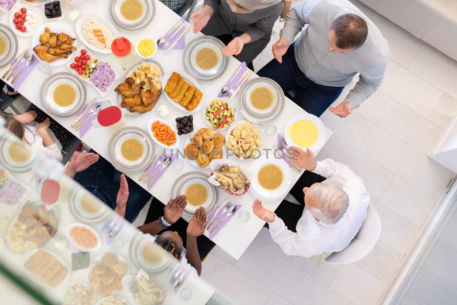 top view of modern muslim family having a Ramadan feast by dotshock