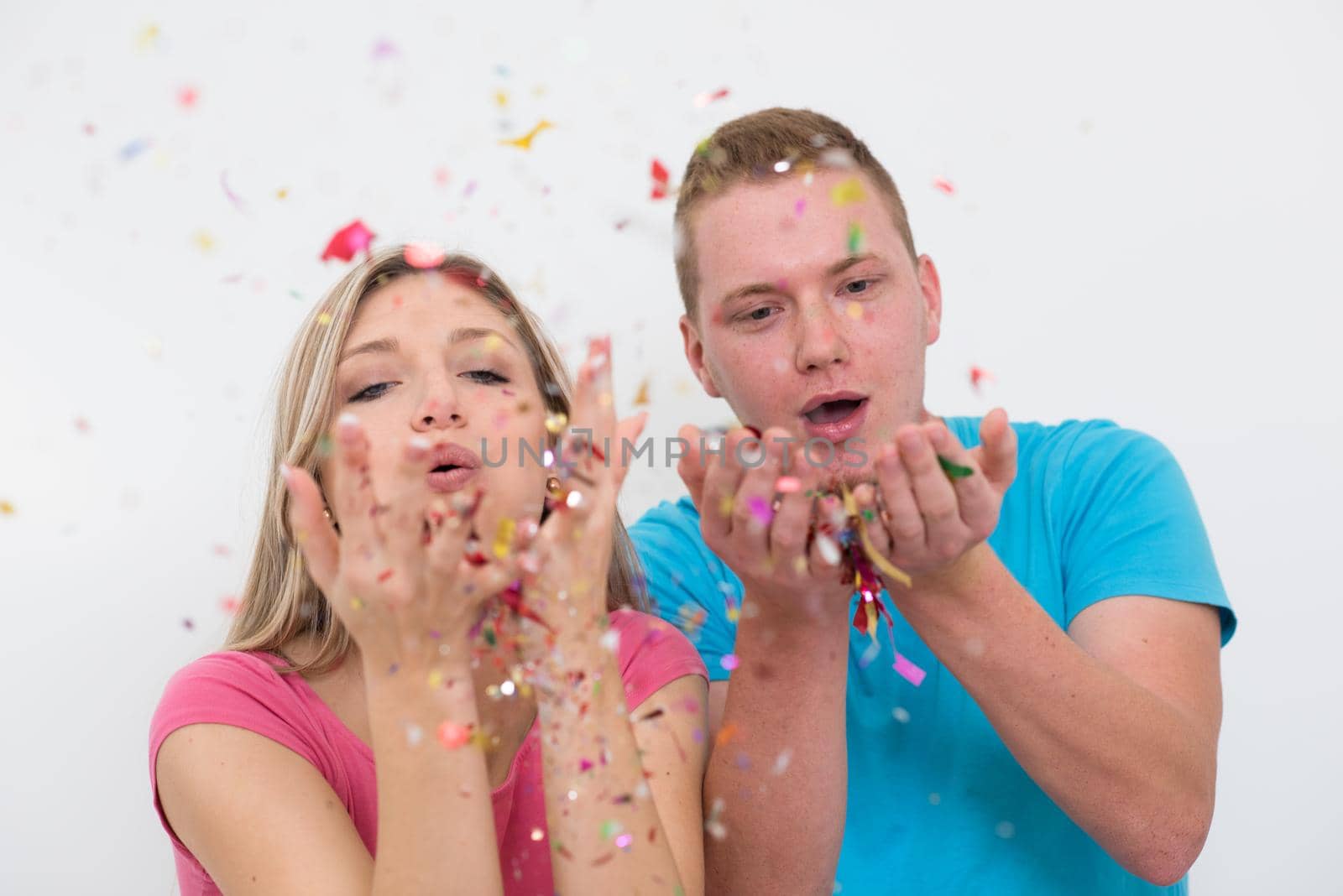 romantic young  couple celebrating  party with confetti by dotshock