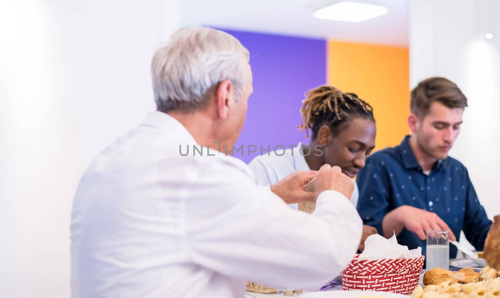 modern multiethnic muslim family enjoying eating iftar dinner together during a ramadan feast at home