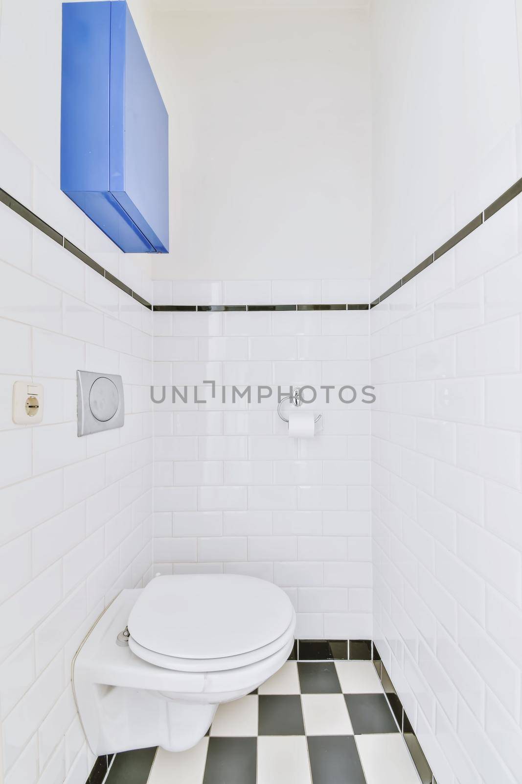 Small restroom with checkerboard floor by casamedia