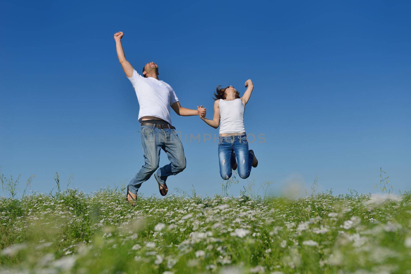 happy young couple in love have romance and fun at wheat field in summer