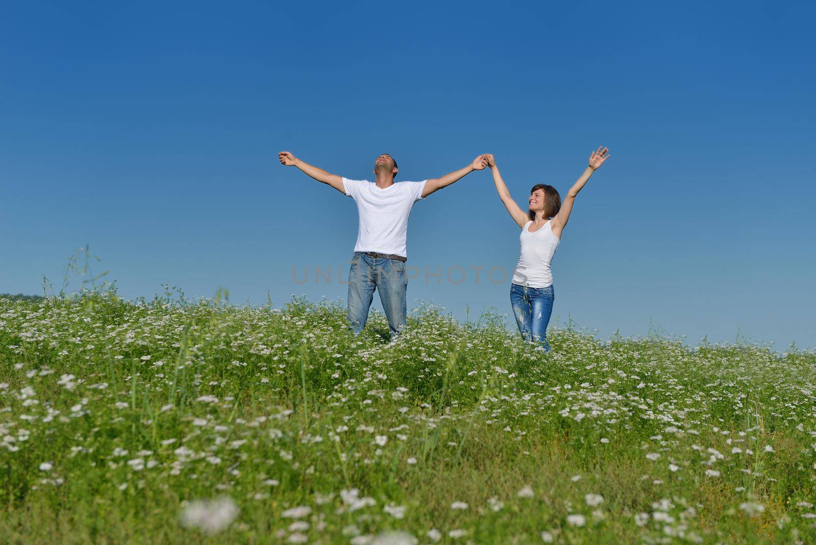 happy young couple in love have romance and fun at wheat field in summer