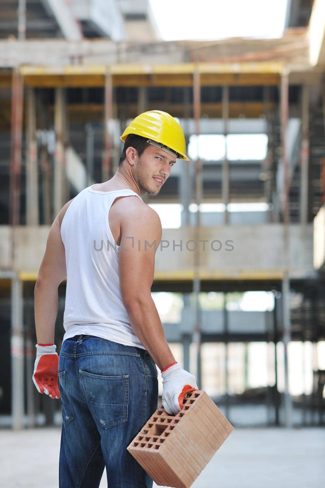 hard worker on construction site by dotshock
