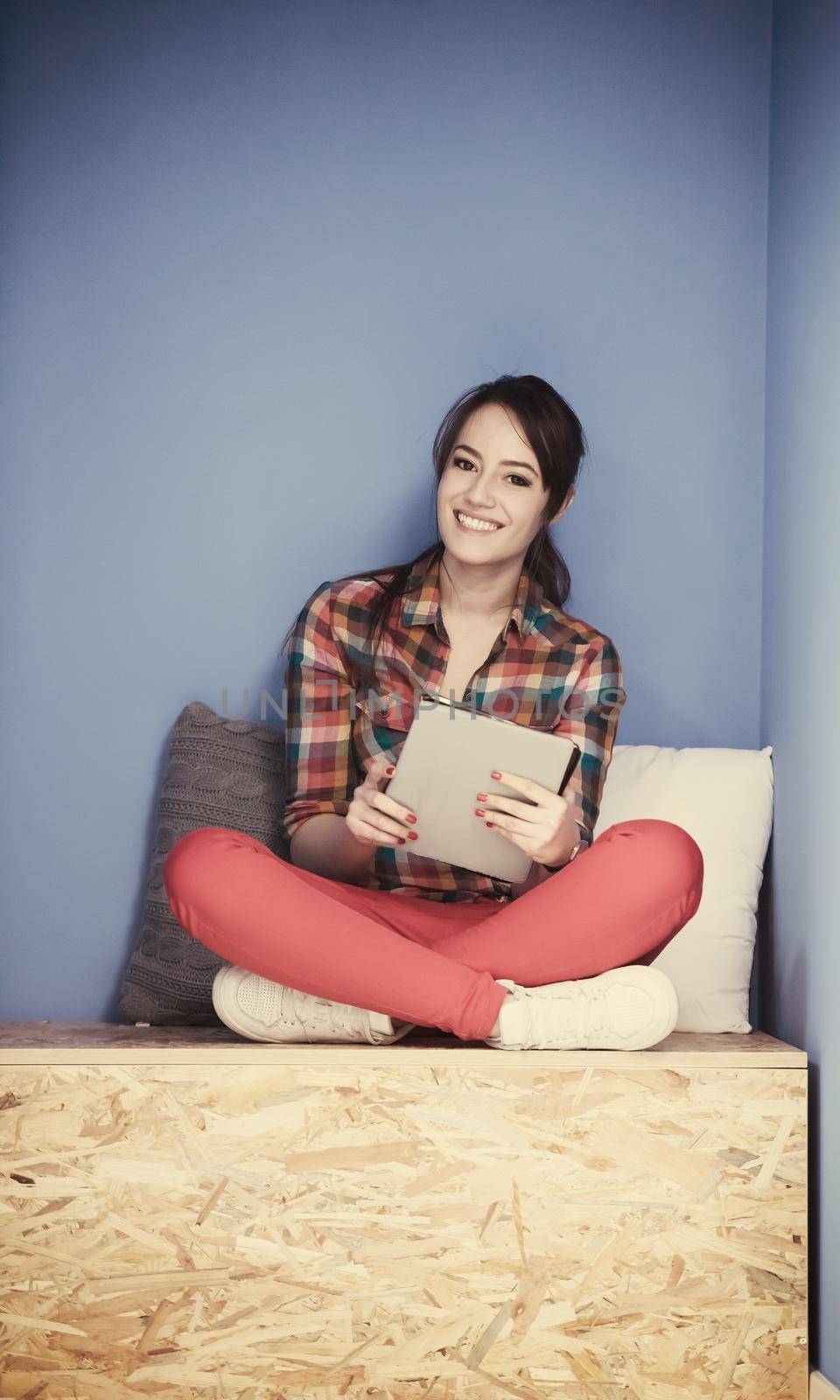 young woman in crative box working on tablet computer, startup business modern office room  interior