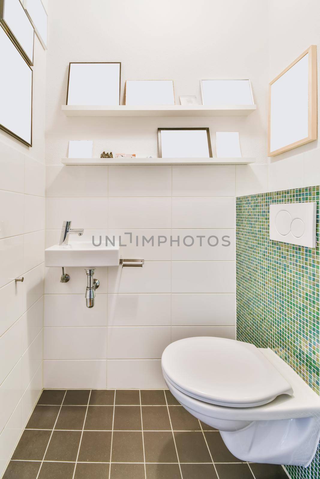 Stylish washroom with brown tiled floor and many paintings