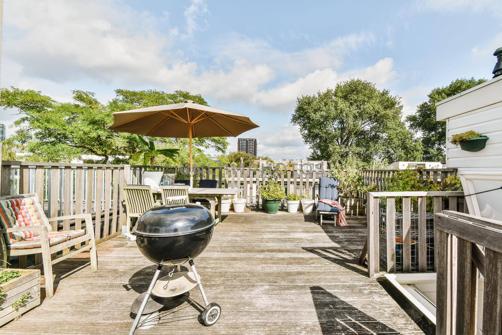 Exterior of the roof of the house with a delightful design with comfortable sun loungers and a table
