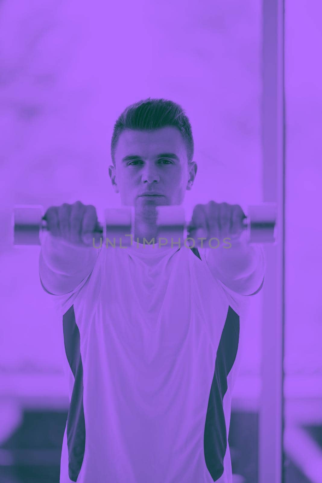 young man in fintess sport club exercise with weights and relaxing duo tone