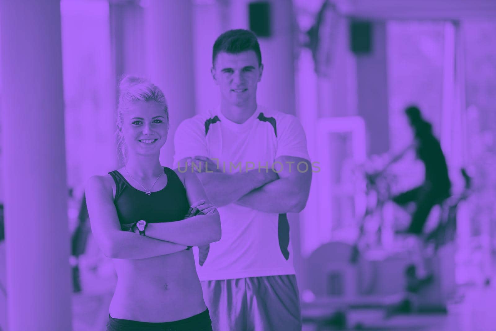 group portrait of healthy and fit young people in fitness gym duo tone