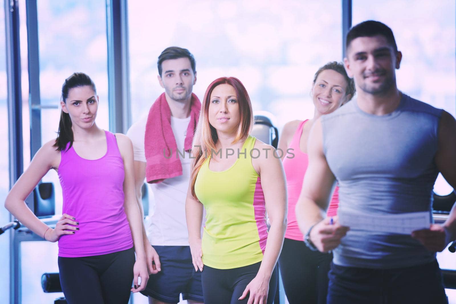 Group of people exercising at the gym by dotshock