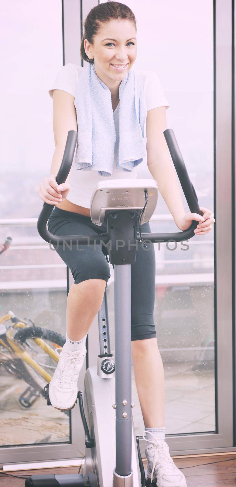 young woman exercise fitness and workout while run on track in sport club