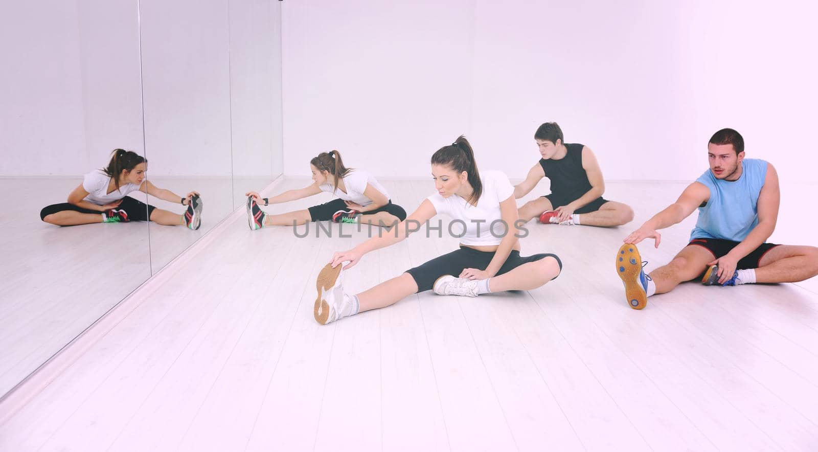 young people group in fitness club by dotshock