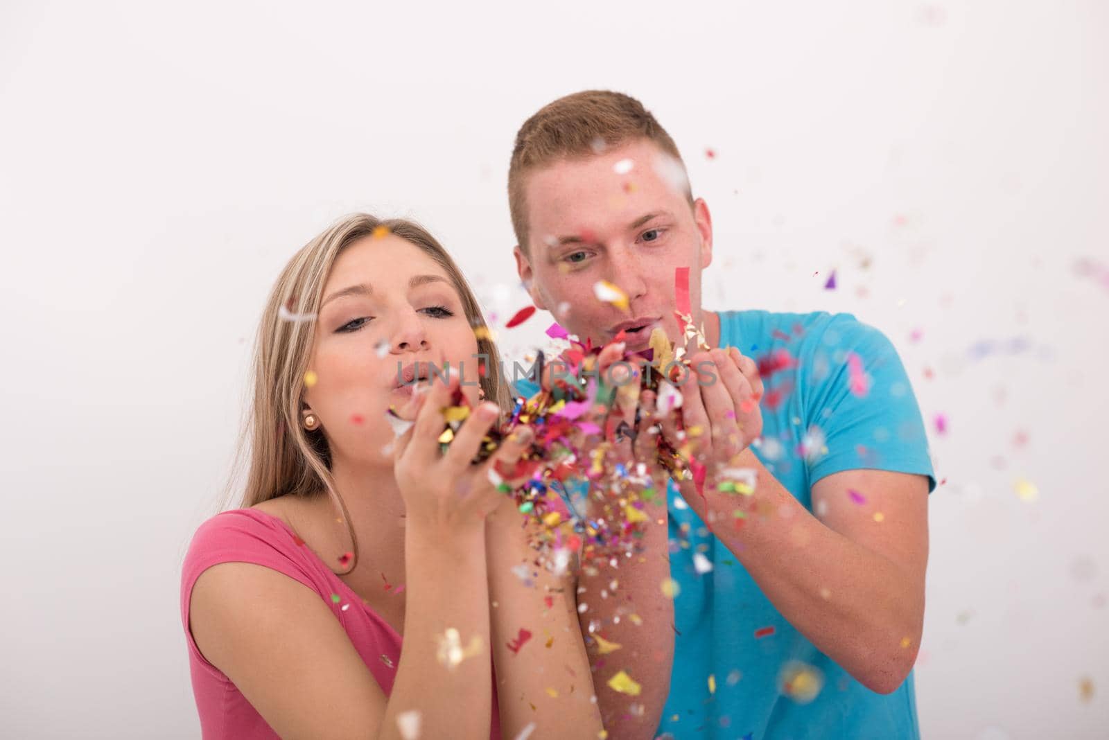 romantic young  couple celebrating  party with confetti by dotshock