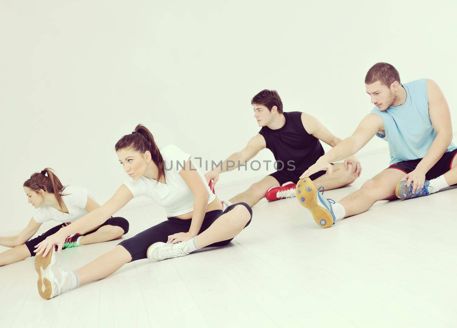 young people group in fitness club by dotshock
