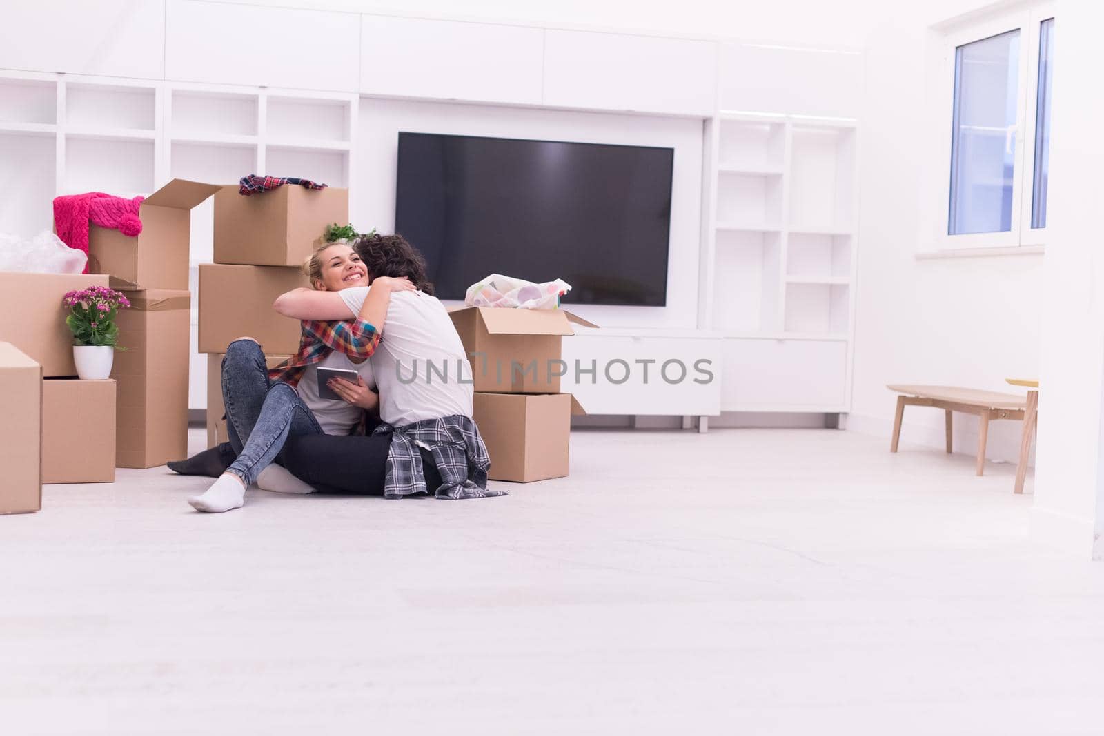 young couple moving  in new house by dotshock