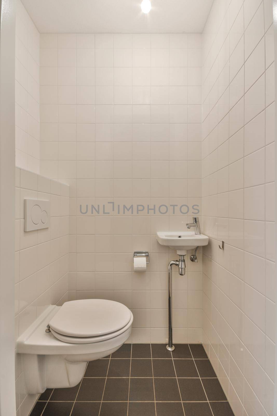 Interior of small clean restroom in miniature style