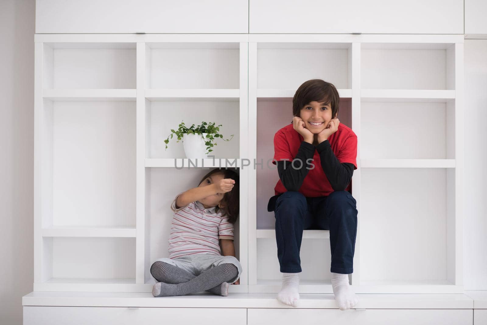 young boys posing on a shelf by dotshock