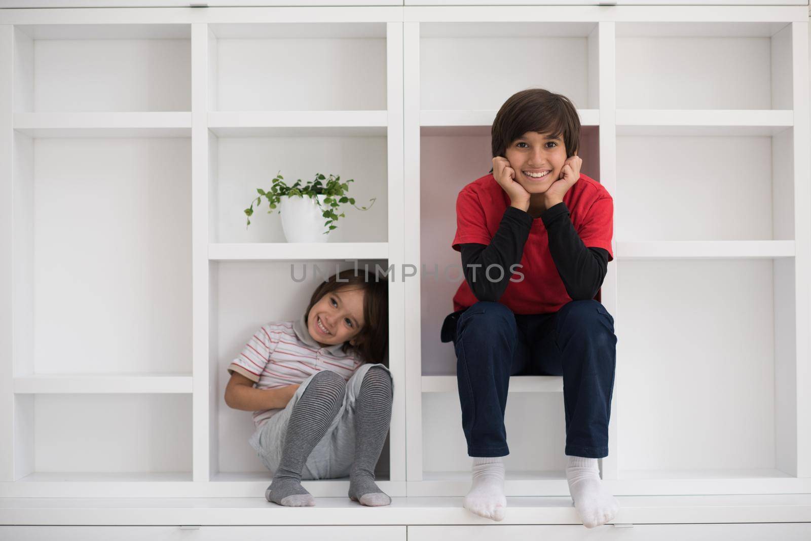 young boys posing on a shelf by dotshock