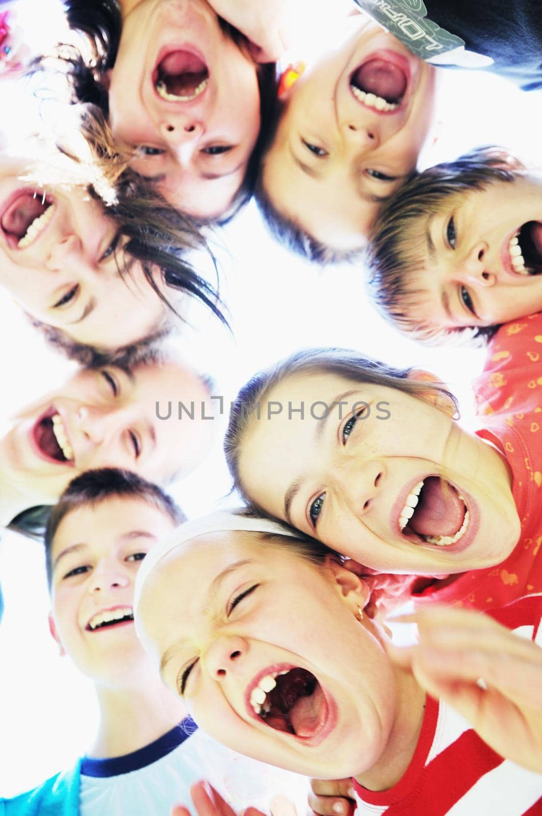 happy child group smilling together and hold heads very close