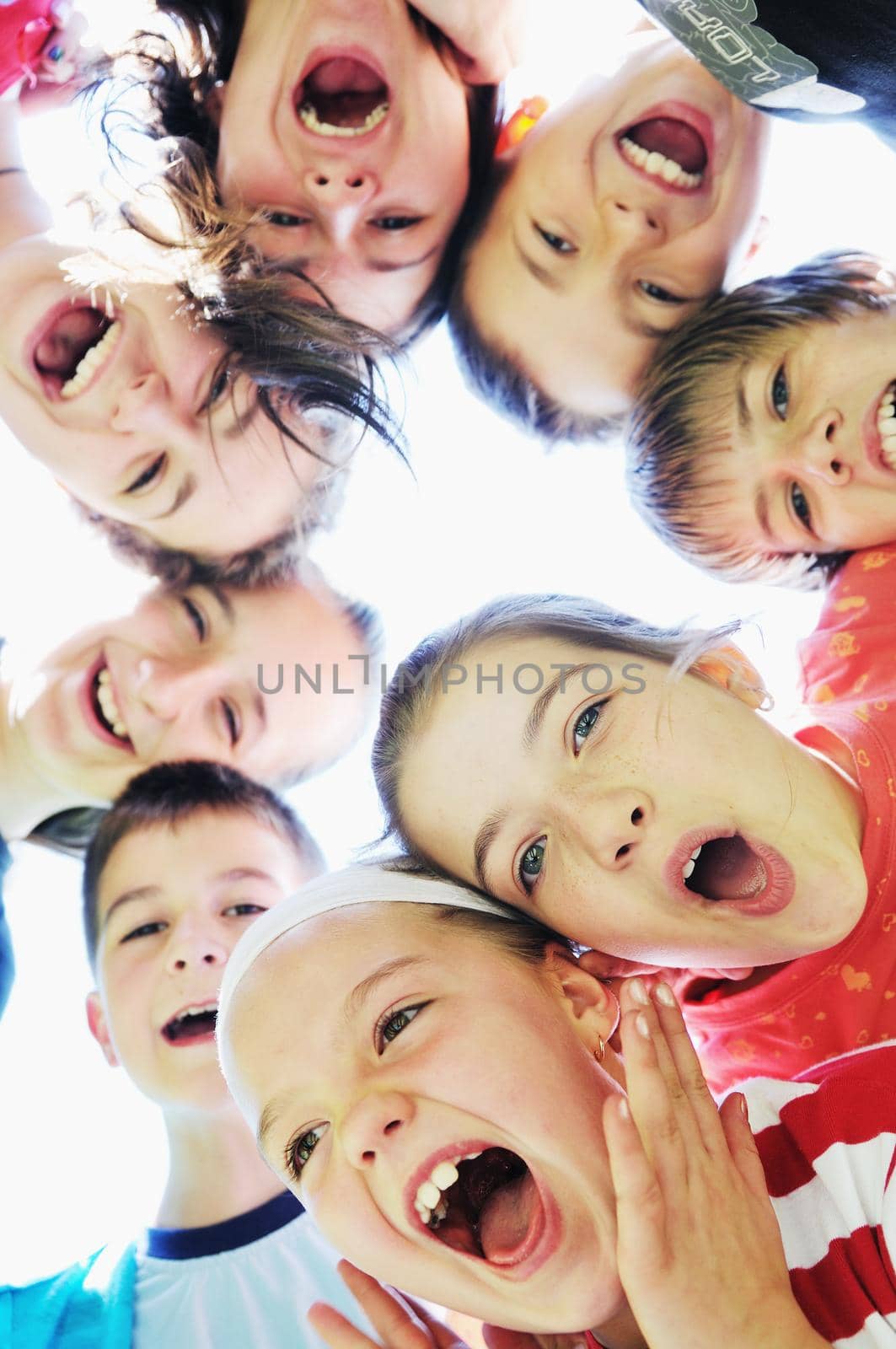 happy child group smilling together and hold heads very close
