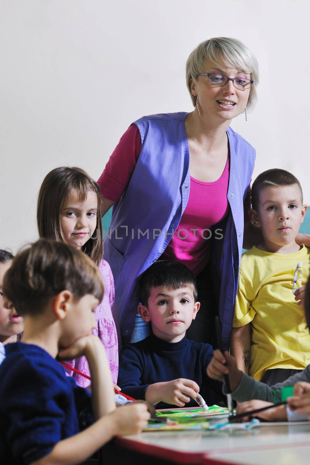 happy child kids group have fun and play at kindergarden indoor preschool education concept with  teacher