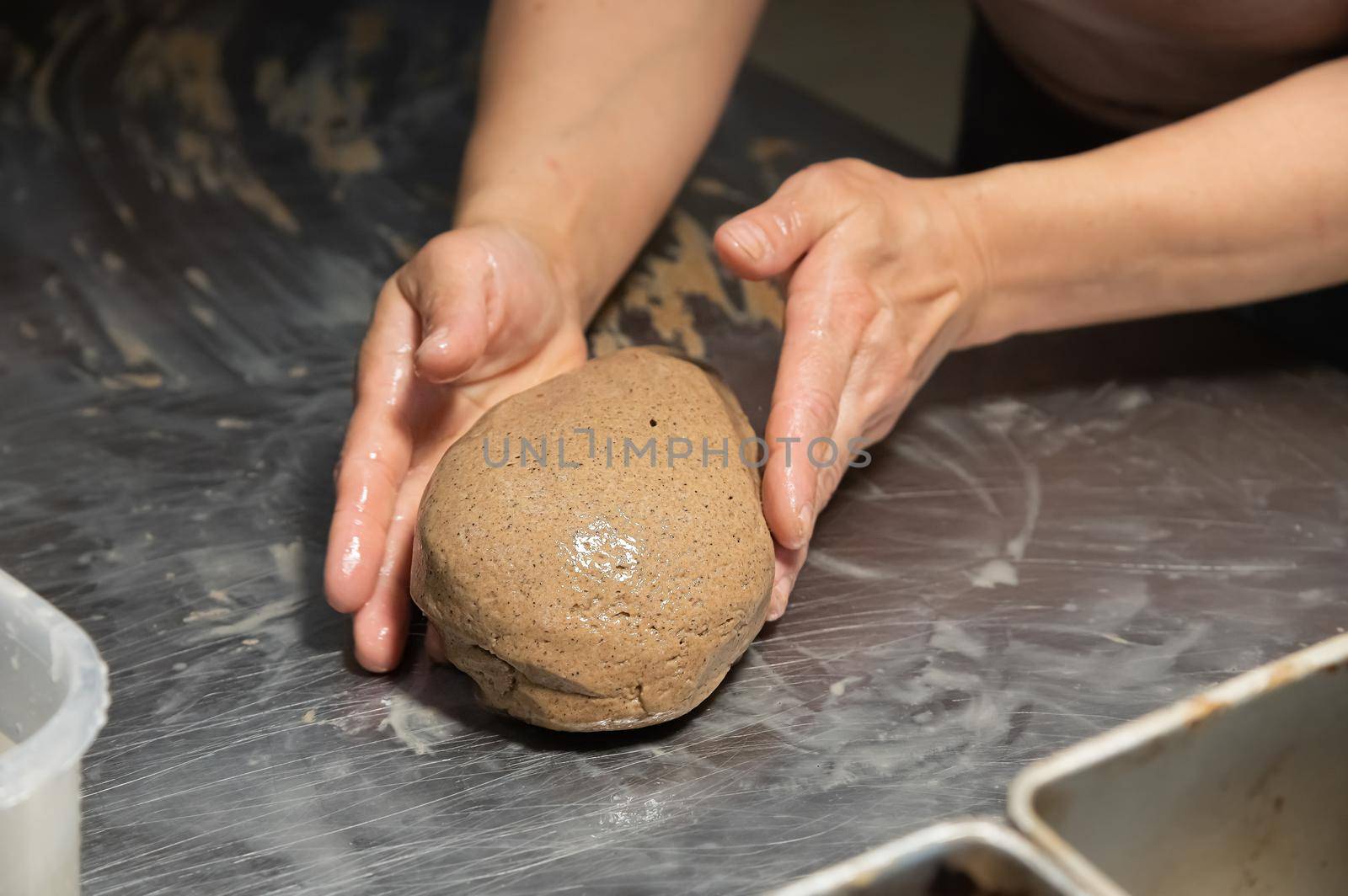 Close-up baker making bread, female hands, kneading dough, cooking by yanik88