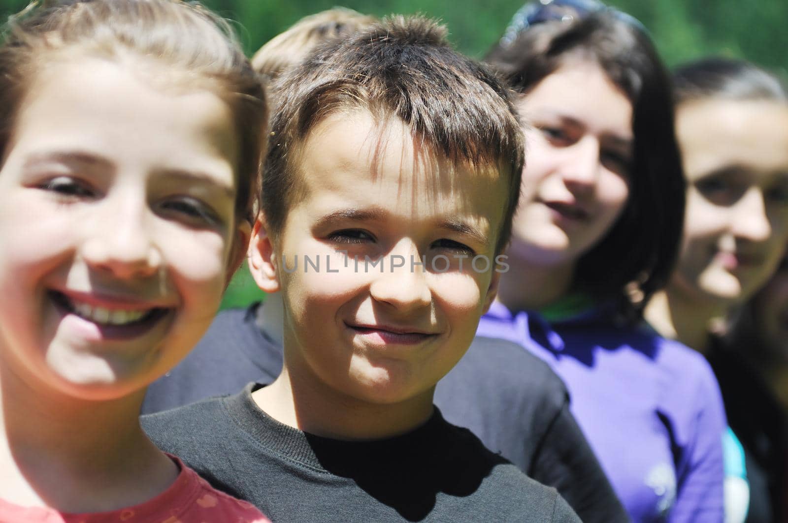 happy children group  have fun outdoor in nature at suny day