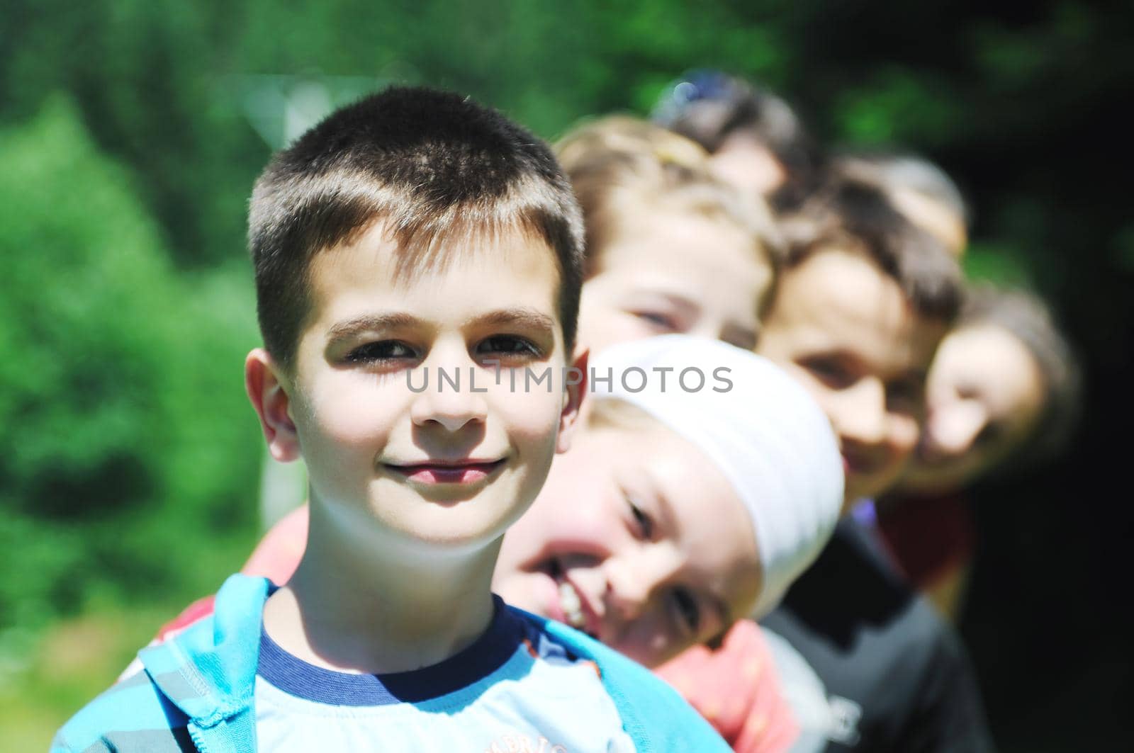 happy children group  have fun outdoor in nature at suny day