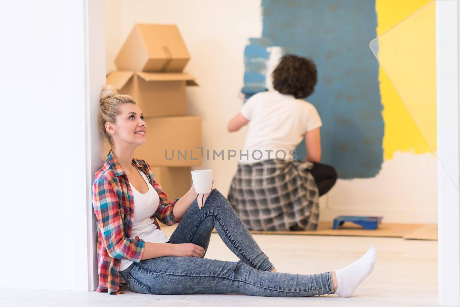 young couple doing home renovations by dotshock