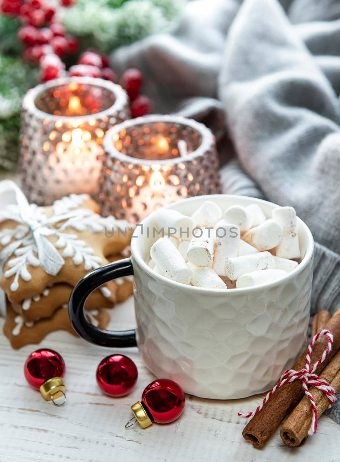 Christmas decorations, cocoa and gingerbread cookies. White wooden background.