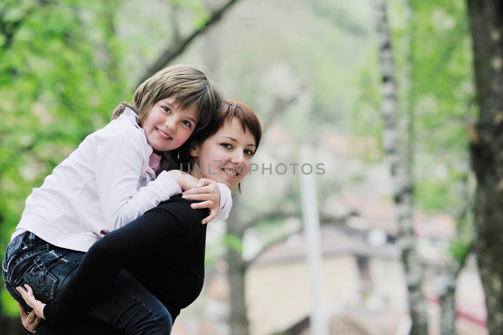 happy girl and mom outdoor by dotshock