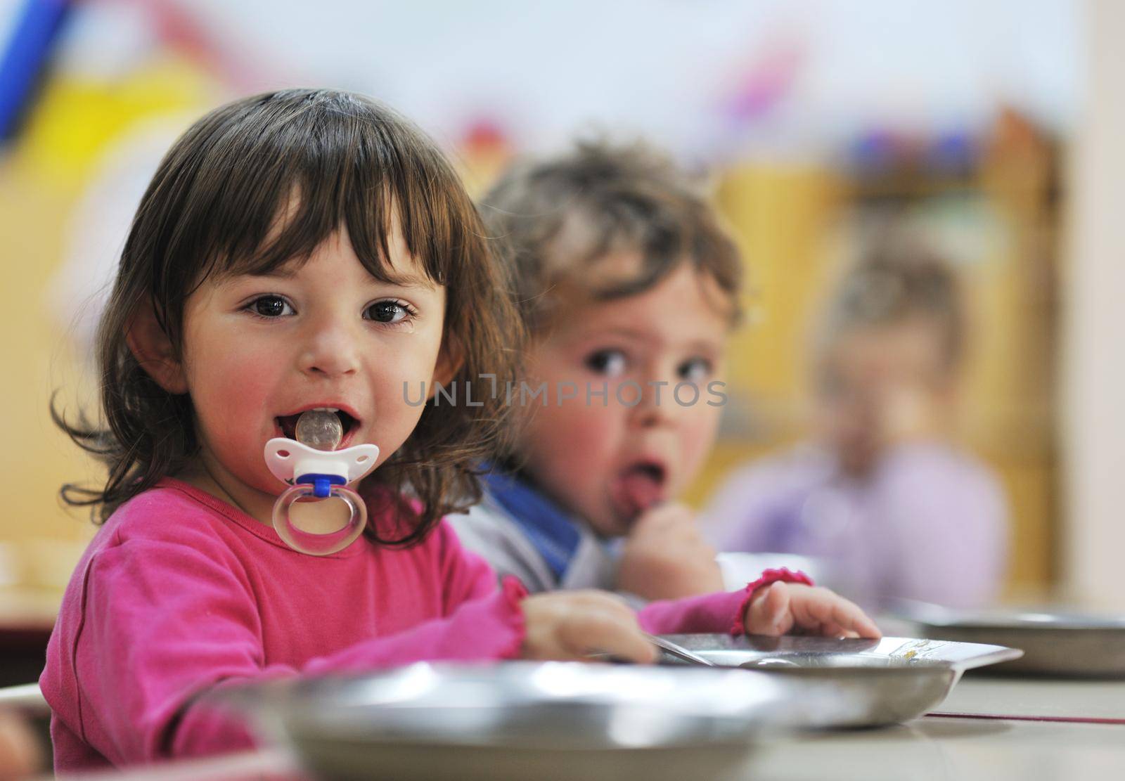 happy child kids group have fun and play at kindergarden indoor preschool education concept with  teacher