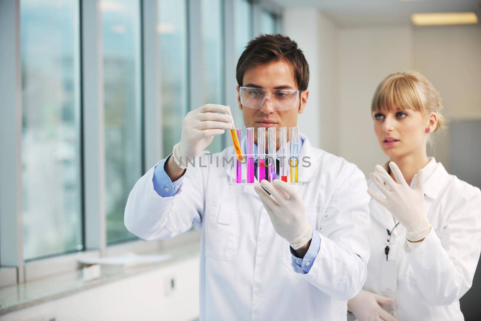 science people in bright lab by dotshock