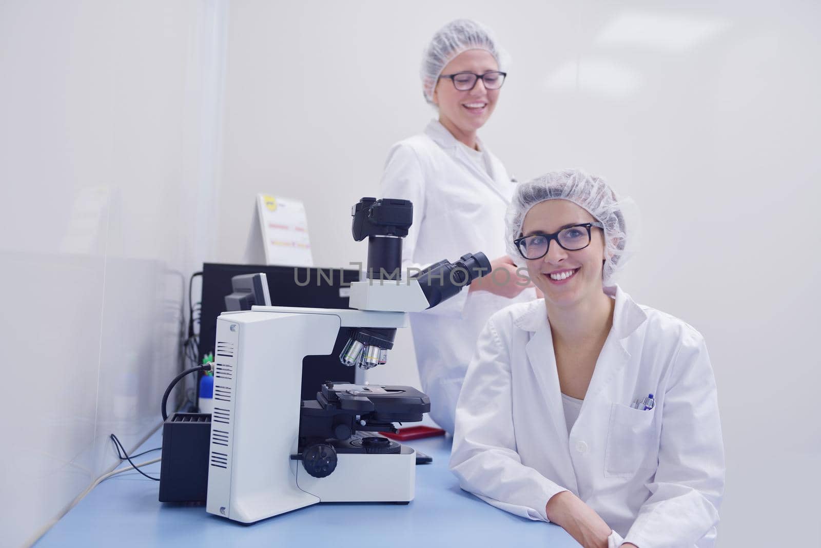 scientists working at the laboratory by dotshock