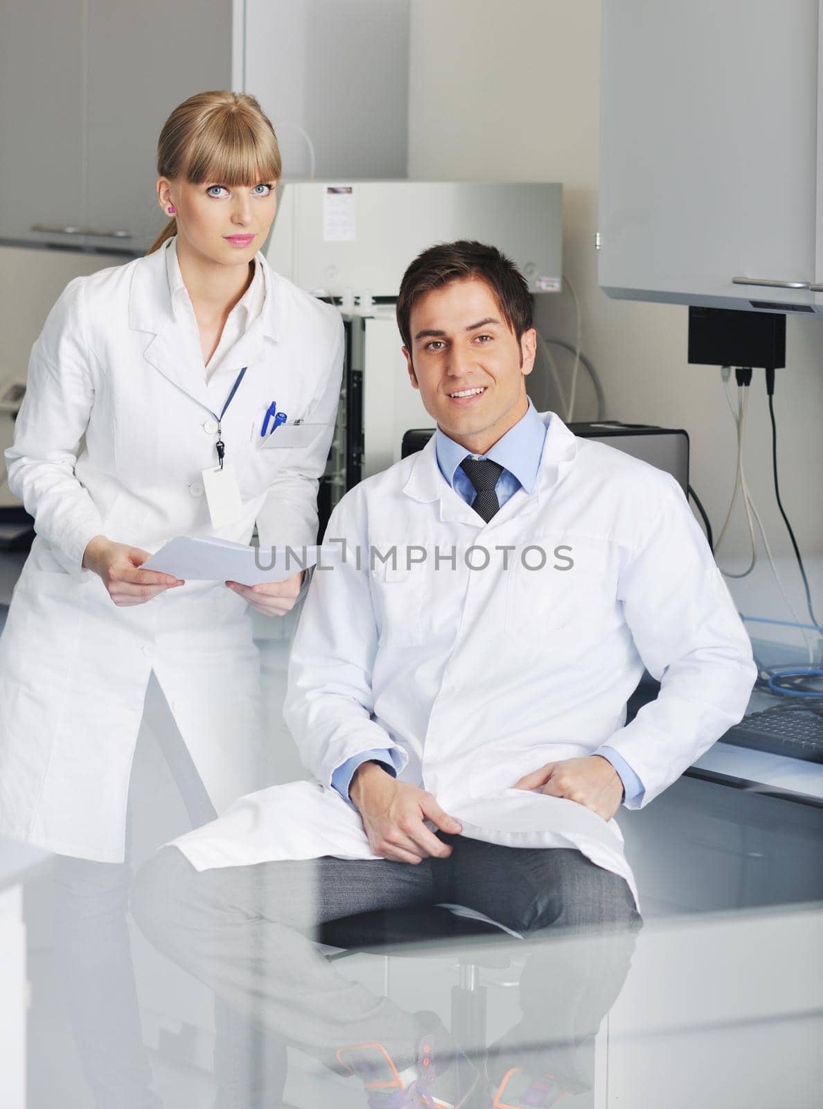 science people in bright lab by dotshock