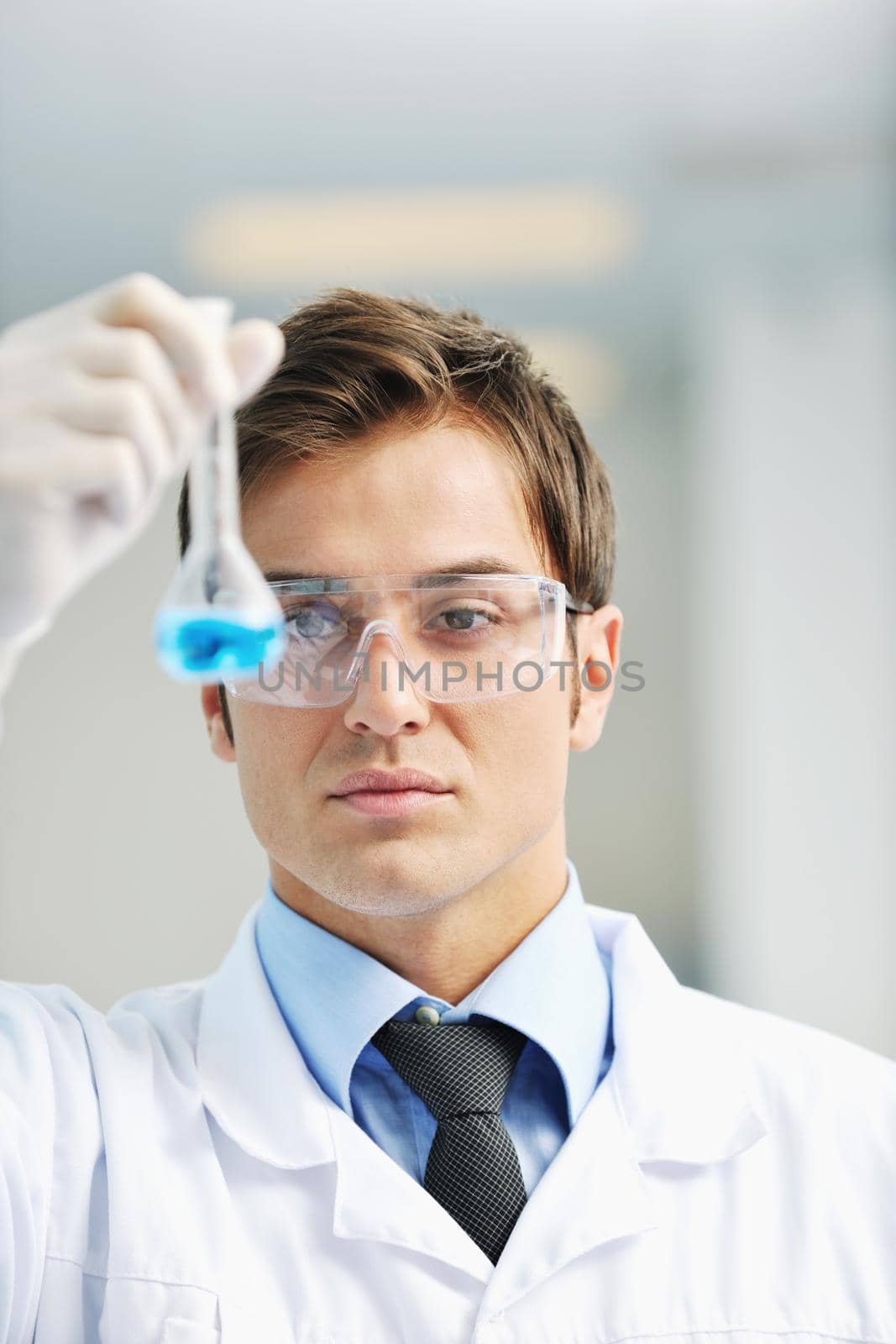 research and  science people  in laboratory by dotshock