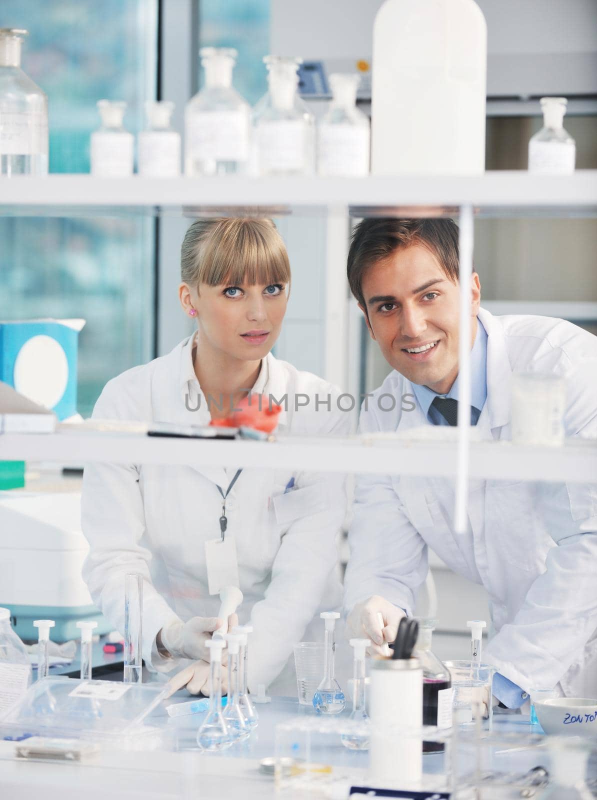 science people in bright lab by dotshock