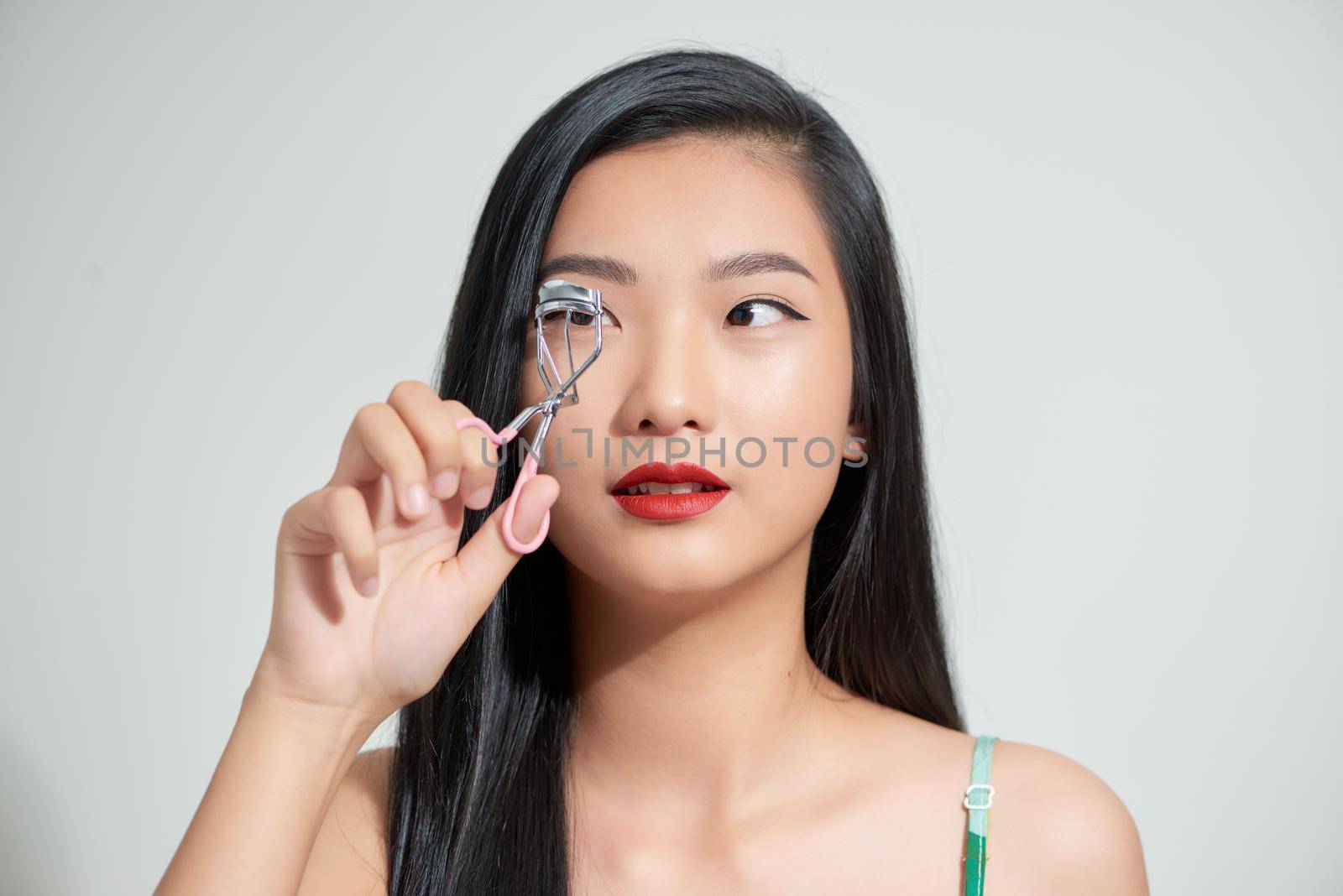young attractive asian woman beauty image,eyelash curler