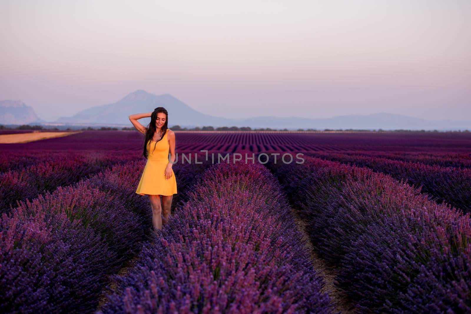 woman in yellow dress at lavender field by dotshock