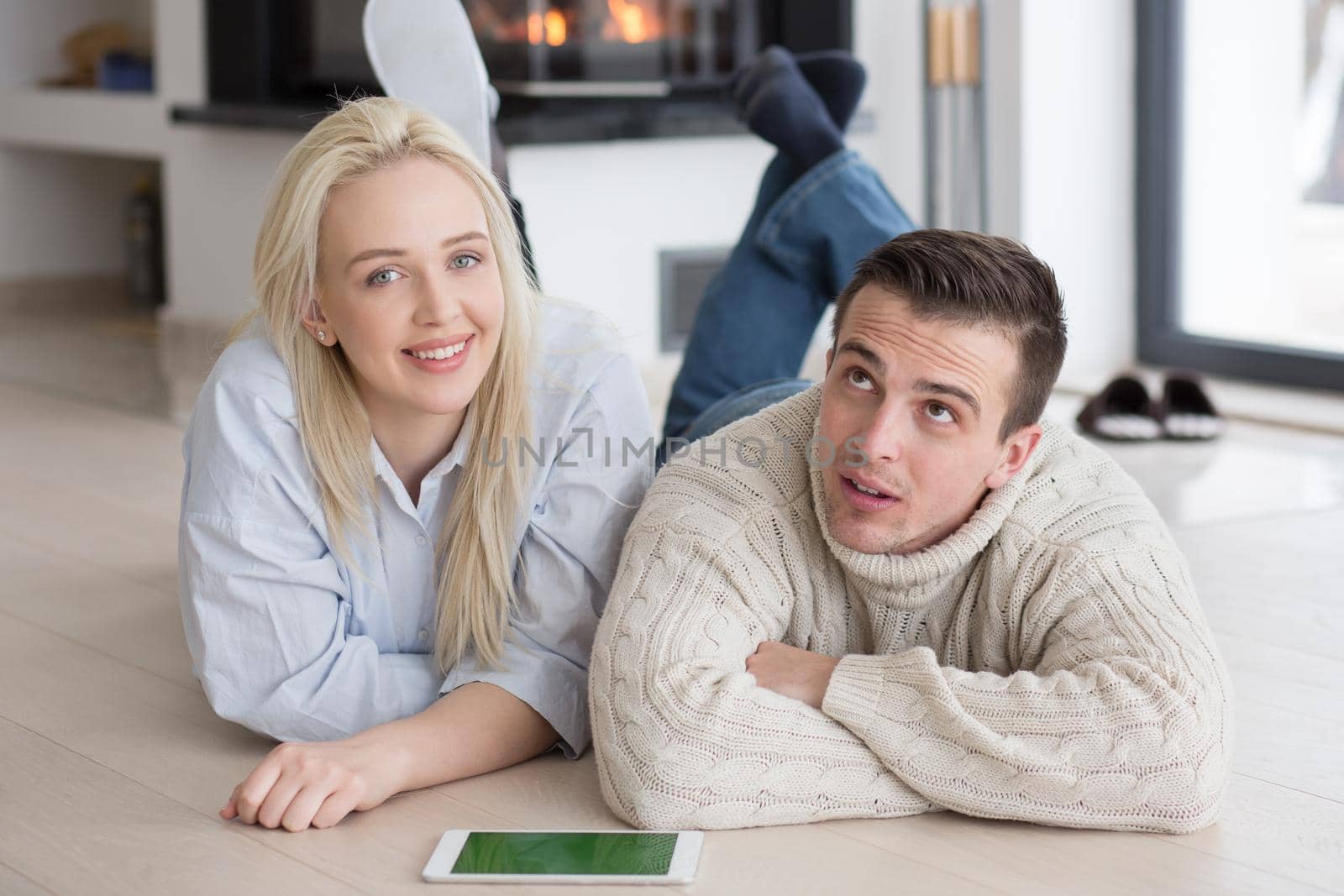 Young Couple using digital tablet on cold winter day by dotshock