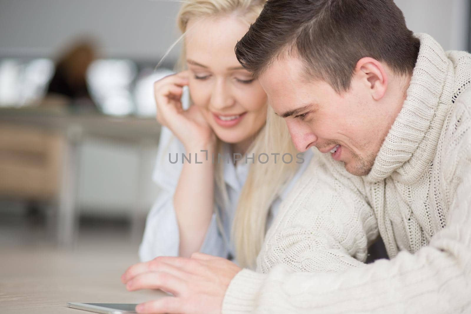 Young Couple using digital tablet on cold winter day by dotshock