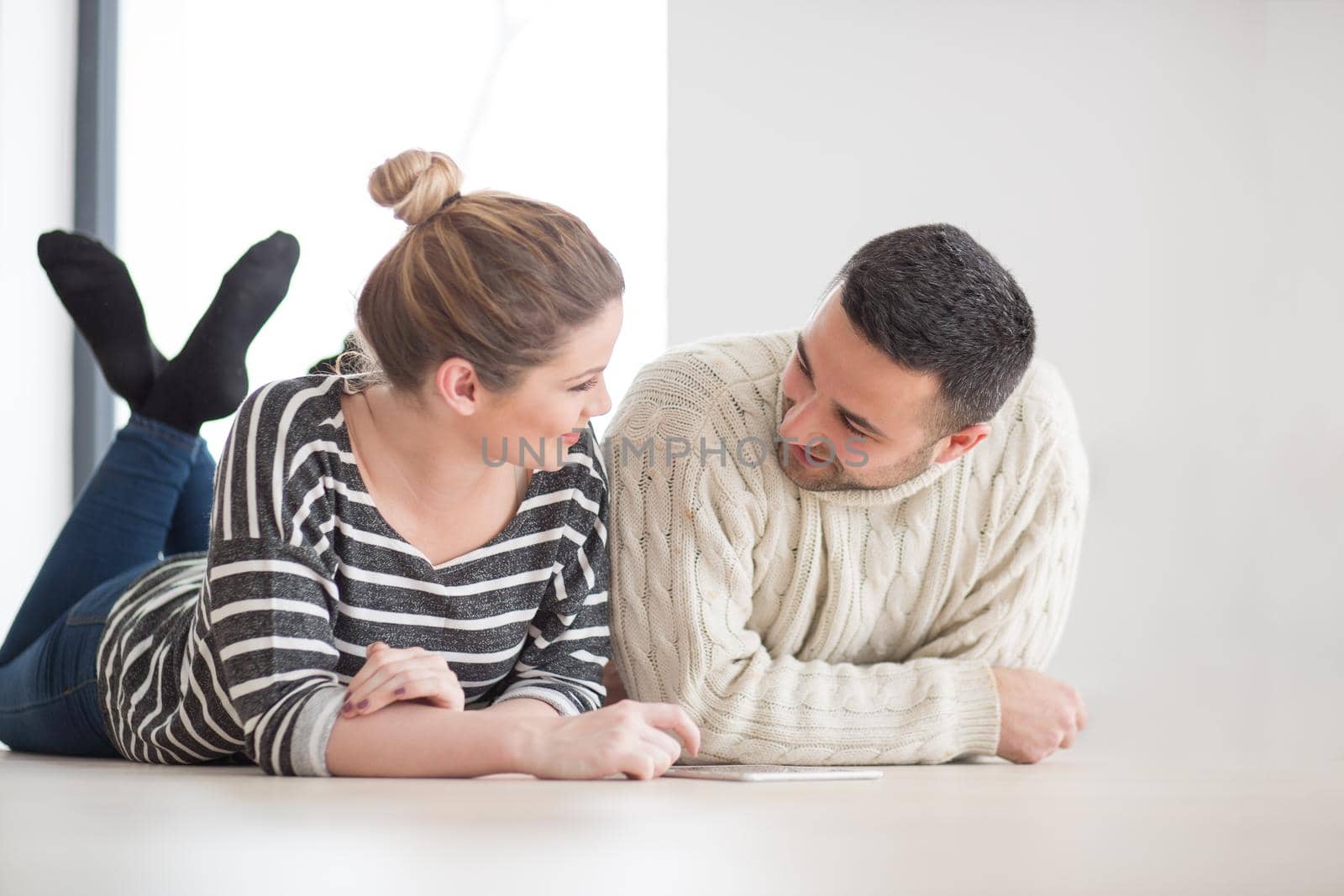 Young Couple using digital tablet on cold winter day by dotshock