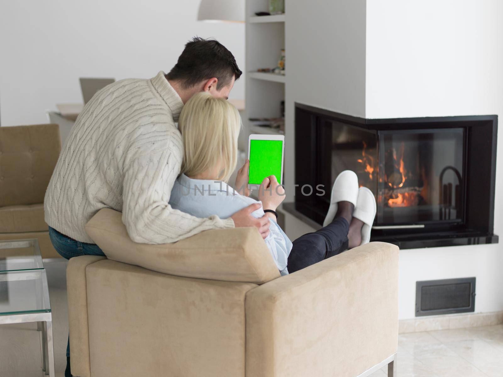 Couple using digital tablet on cold winter day by dotshock