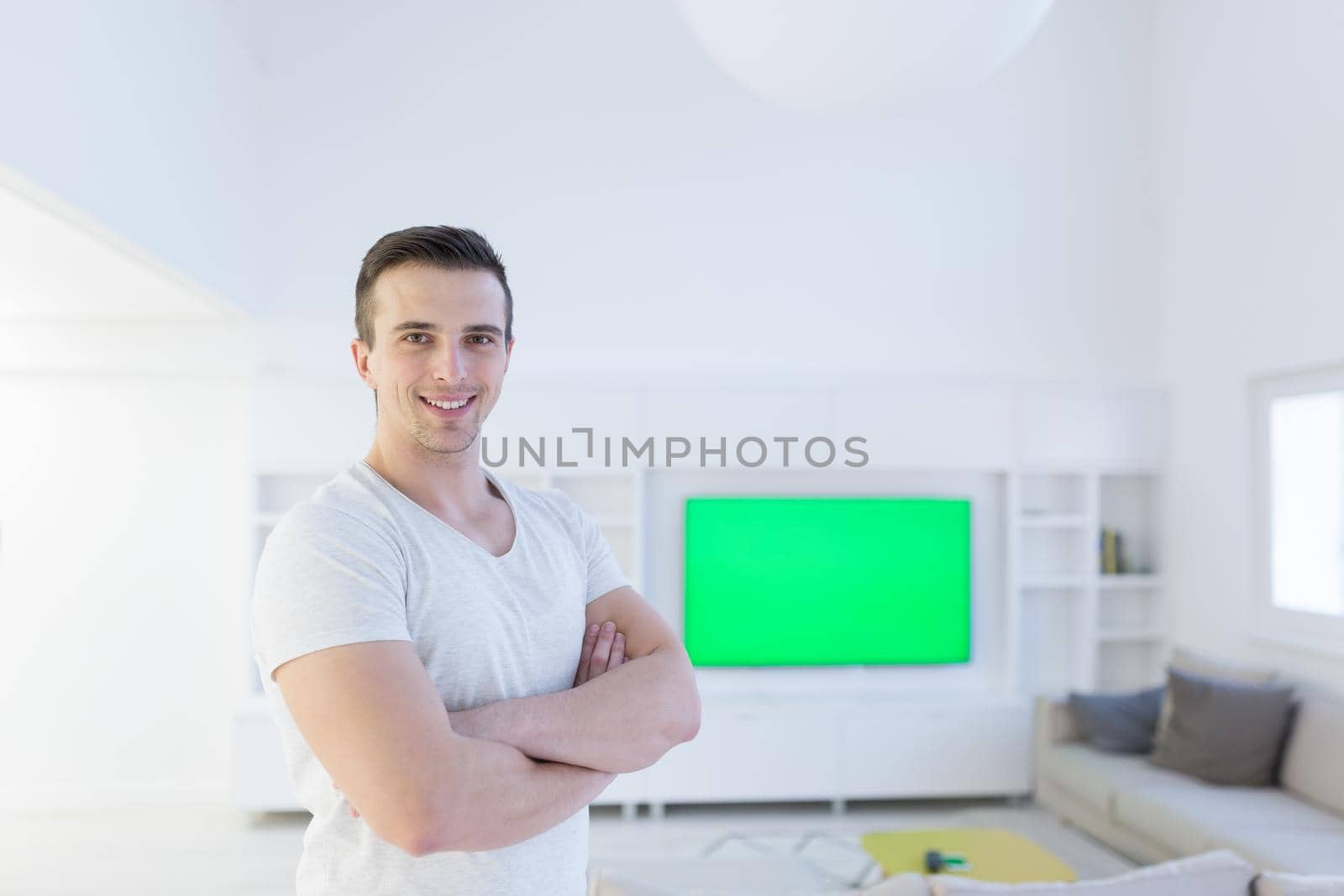 Portrait of a young man at home by dotshock