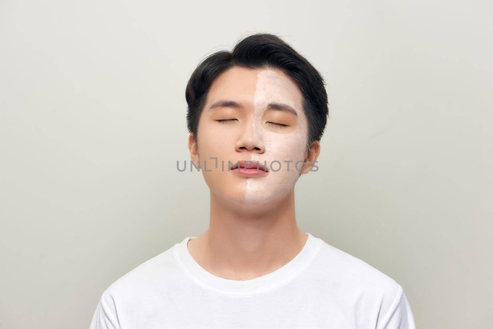 Male  wearing clay face mask beauty treatment.