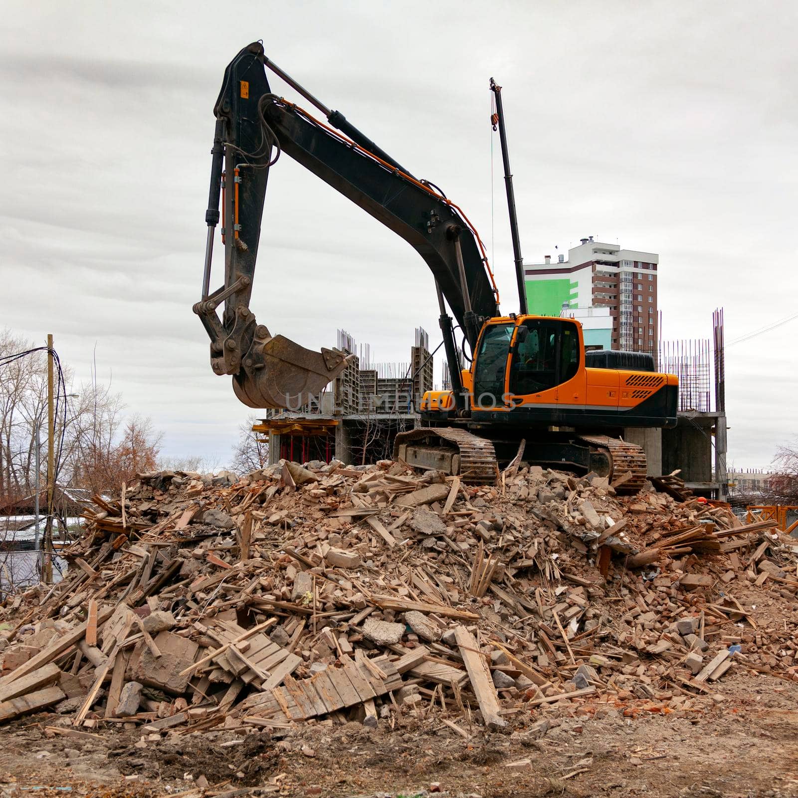 Demolition of an old building by modern excavator