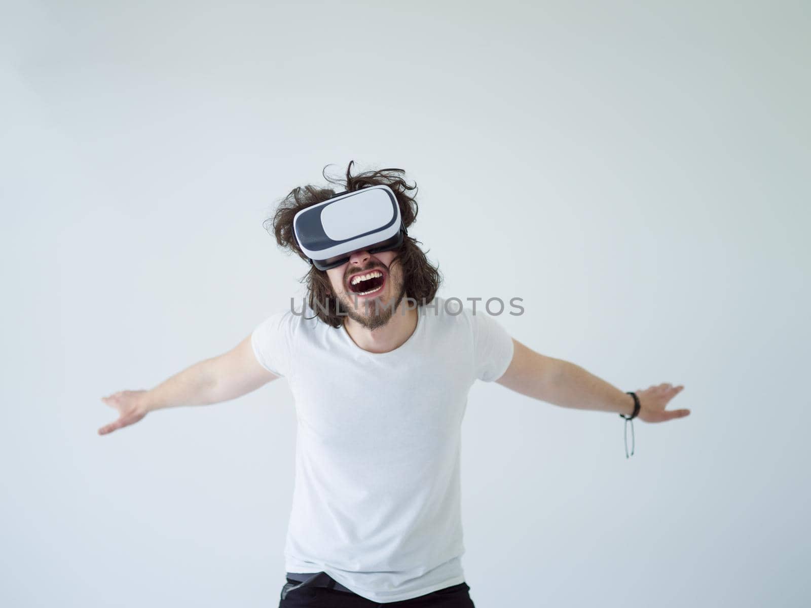 Man using headset of virtual reality by dotshock