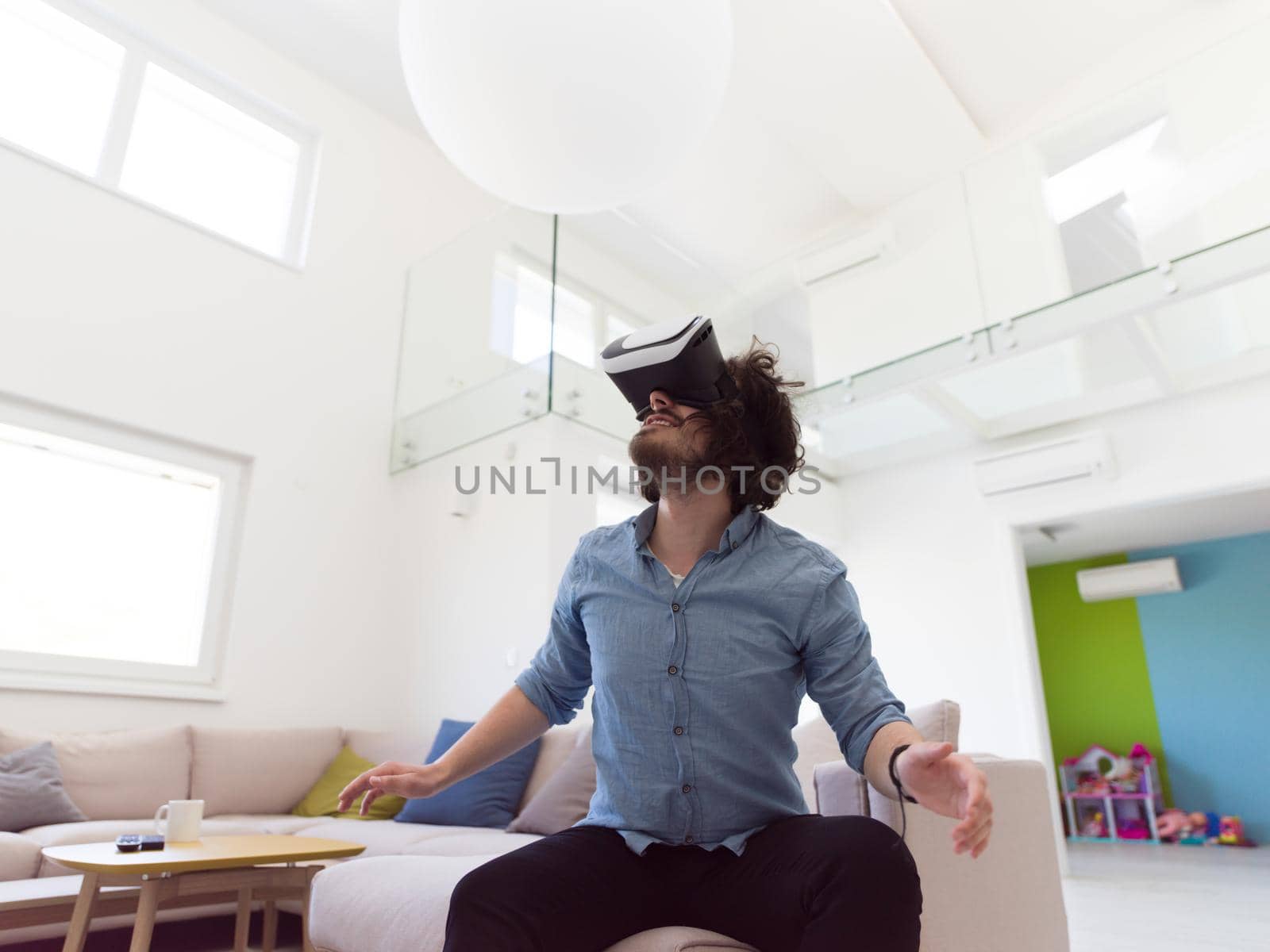 man using VR-headset glasses of virtual reality by dotshock